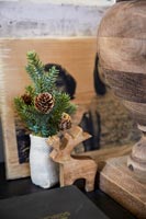 Christmas decorations - small wooden reindeer and pine cone
