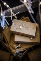 Christmas gifts wrapped in brown paper 