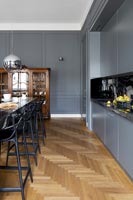 Contemporary kitchen dining area with classic parquet floor