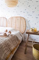 Country bed and wooden bedside table