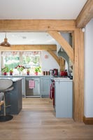 Modern country kitchen with exposed wooden beams 