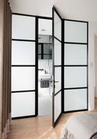 Black framed glass internal door to bathroom 