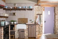 Lilac painted door in country kitchen 