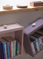 Wall mounted drawers used as bookshelves 