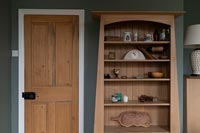 Detail of oak storage unit with pine door
