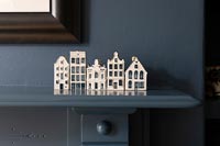 Detail of porcelain houses on mantlepiece
