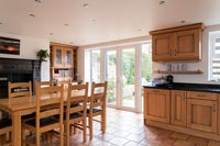 Oak kitchen with table and range
