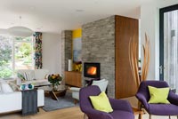 Contemporary living room with lit fire