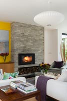 Lit fire in contemporary living room 