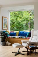 Colourful cushions on built in window seat 