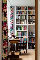 View through internal door to bookshelves 