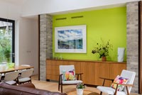 Lime green feature wall in contemporary dining room 