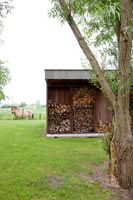 Log store in large garden with pony and countryside views 