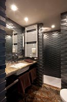 Brick style tiling in modern bathroom 
