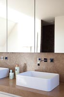 Sink and mirrors in modern bathroom 