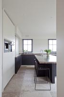 Modern kitchen with stone flooring 