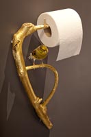 Ornate toilet roll holder in modern bathroom 