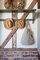 Storage - coat hooks in hallway of country house 