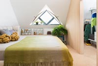Modern bedroom with triangular window 