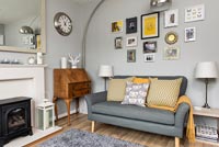 Retro living room with pale grey painted walls 