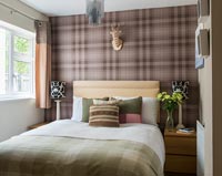 Modern bedroom with checked wallpaper 