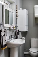 White bathroom with grey painted walls 