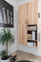 Wall mounted wooden cabinet and modern artwork calendar 