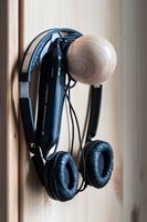 Headphones on cupboard door knob 