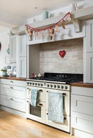 Advent garland hanging over range in classic kitchen 