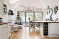 Open plan kitchen diner decorated for Christmas 