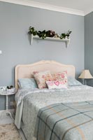 Bedroom with pale grey painted walls 