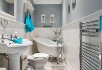 White bathroom with pale grey painted walls 