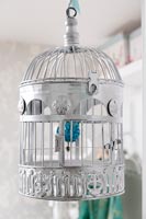 Silver painted bird cage as decoration 