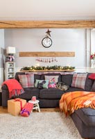 Pet dog on large sofa in modern living room at Christmas 