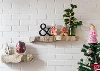 Stone shelves with Christmas decorations 