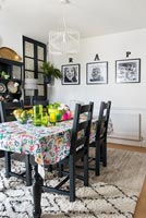 Black painted furniture in modern dining room 