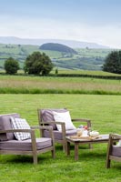 Garden chairs with extensive countryside views beyond 