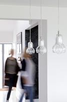 Pendant lights - people blurred in background 