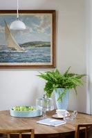 Small dining room table in coastal cottage 