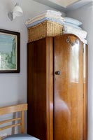 Vintage wooden wardrobe in country bedroom 