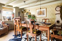 Dining room with vintage furniture including Scandinavian clock