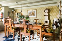 Dining room with vintage furniture including Scandinavian clock