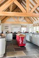 Exposed wooden beams in country kitchen 