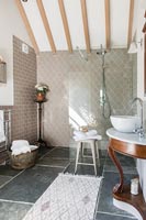 Modern country bathroom with exposed wooden beams 