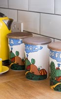 Colourful storage jars for tea, coffee and sugar 