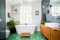 Modern bathroom with bright green flooring 