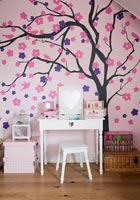 Mural on pink wall in childs room 
