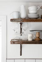 Wooden shelves with crockery and glassware 