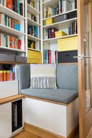 Built in corner seat with bookshelves 