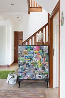 Colourful montage cabinet in modern hallway 